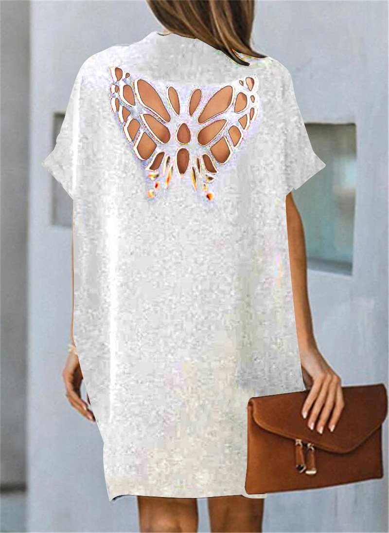 Verano nuevo vestido suelto de color sólido hueco de mariposa