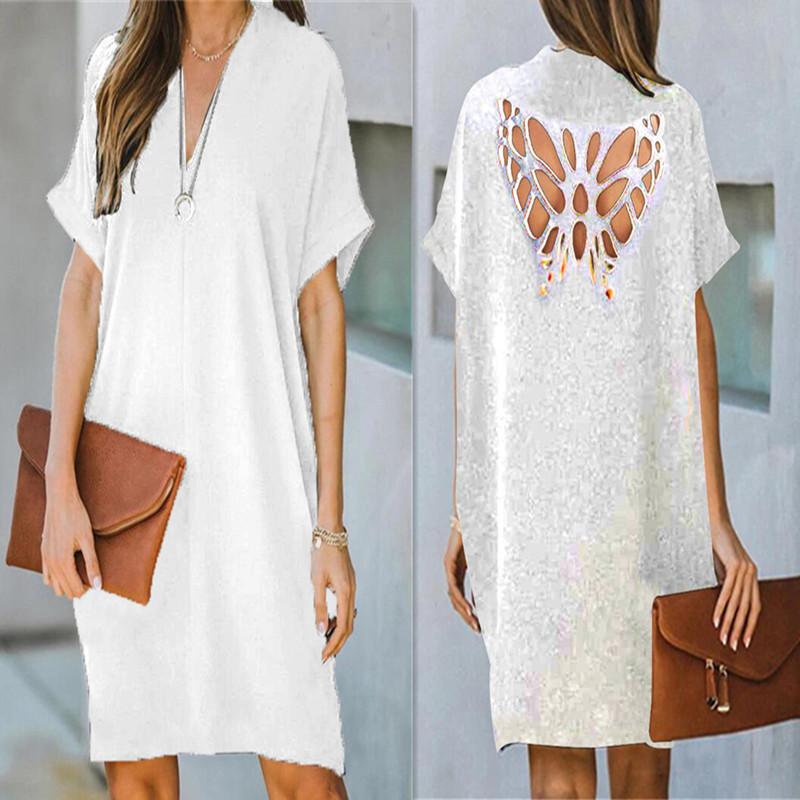 Verano nuevo vestido suelto de color sólido hueco de mariposa