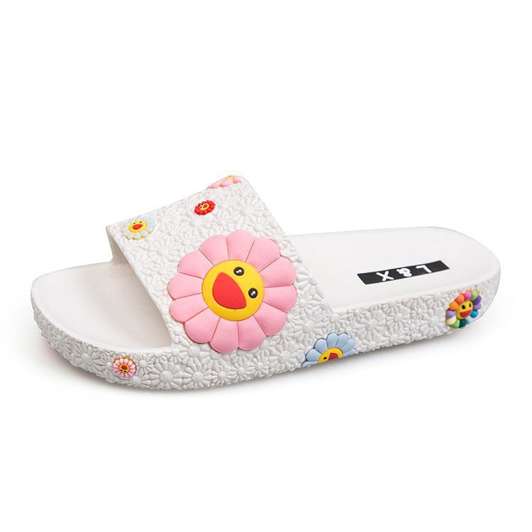 Diapositivas de playa con flores sonrientes coloridas